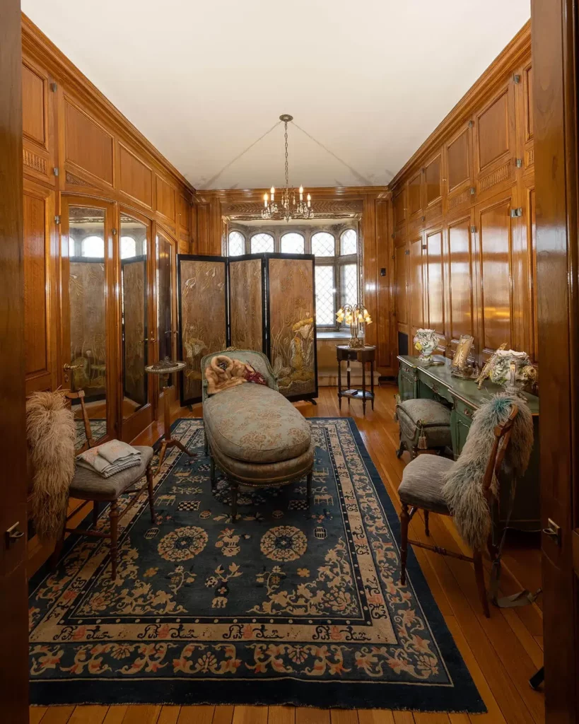 Mrs. Paine’s Dressing Room, with walnut paneling and turquoise furniture.