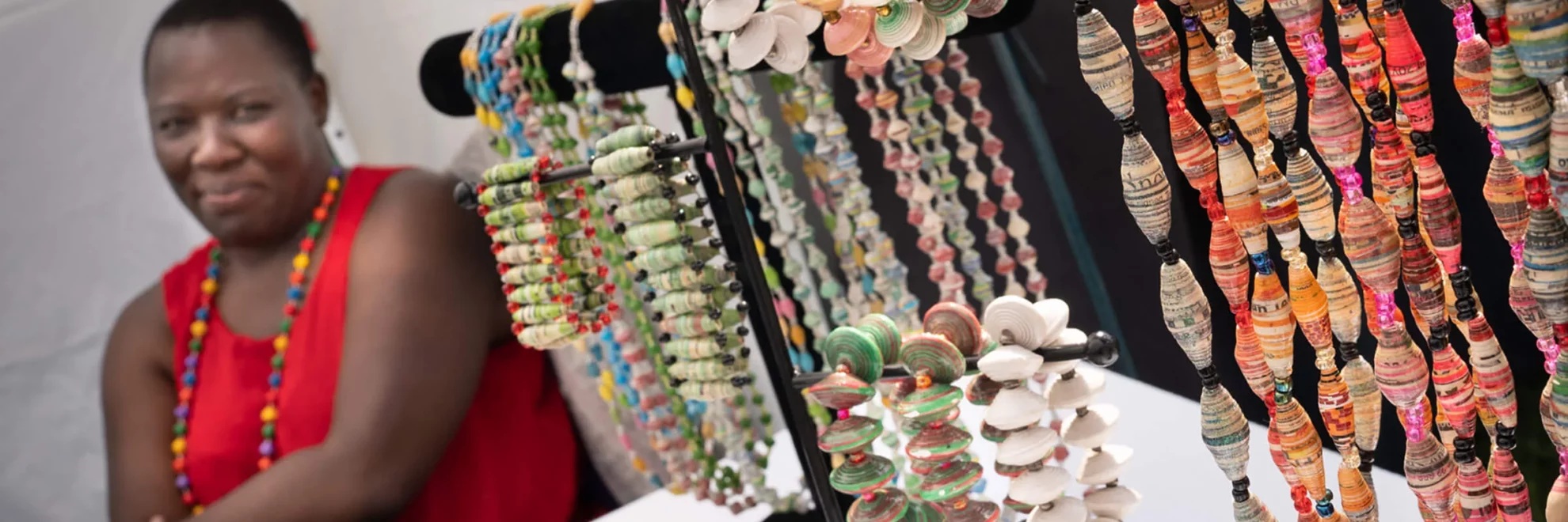 A woman looks at jewelry she is selling at Festival of Spring.