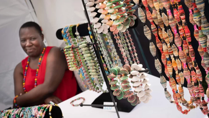 A woman looks at jewelry she is selling at Festival of Spring.