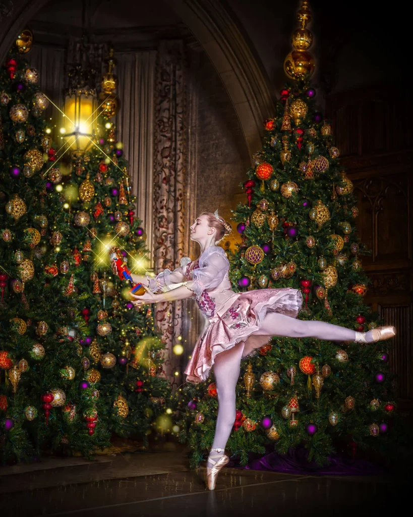 A ballerina dances holding a toy nutcracker.