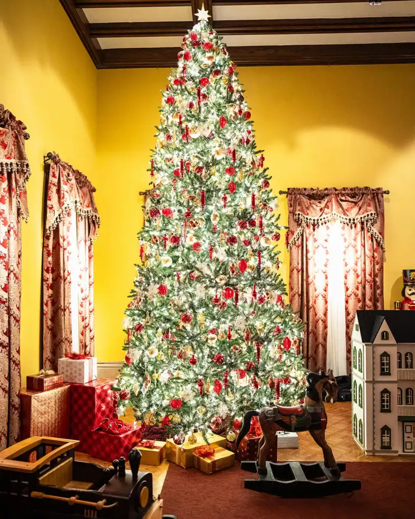 A giant Christmas tree in the main gallery of the Paine mansion.