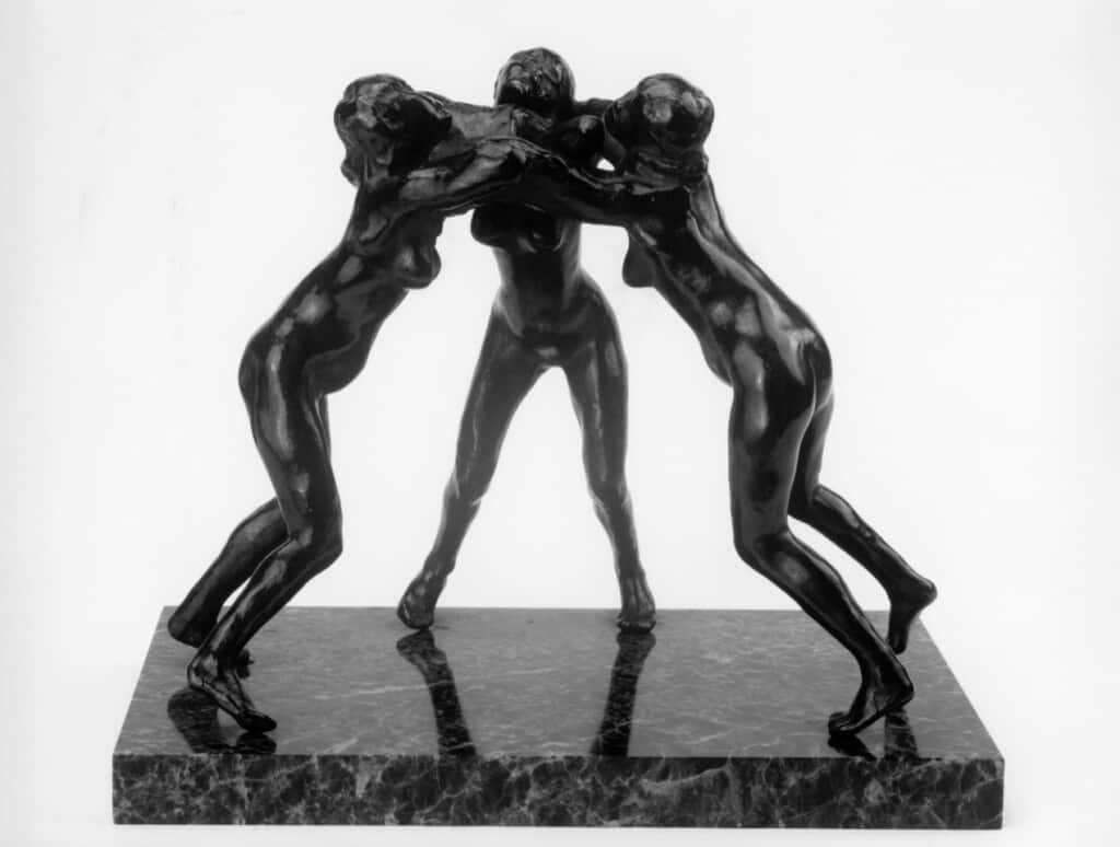 A bronze sculpture, "Three Faunnesses" by Auguste Rodin.