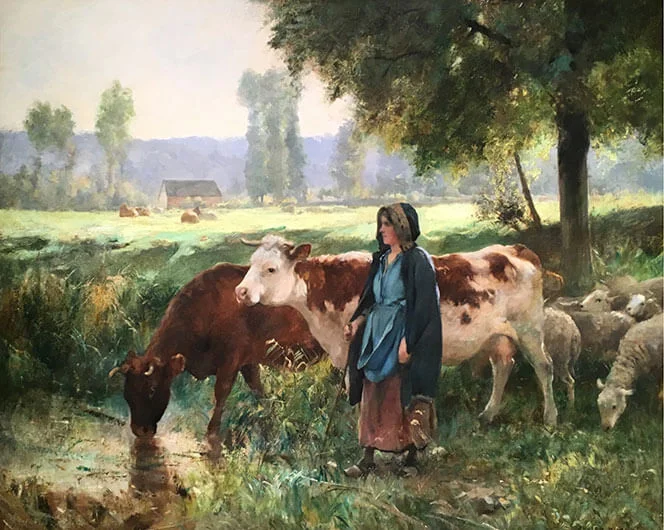 A peasant women dressed in blue with brown cows and sheep in the shade of a tree.
