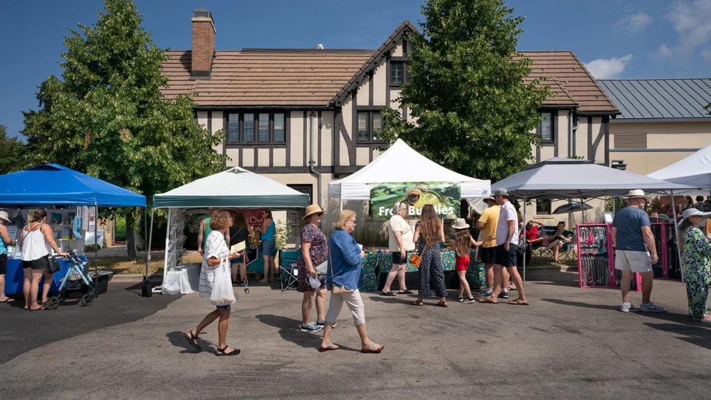 Shoppers peruse booths at Faire on the Green in 2023.