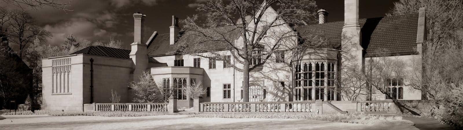 A black and white photo of the Paine mansion façade.