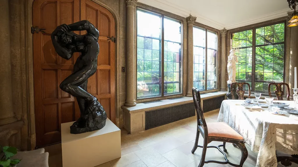 A sculpture by Auguste Rodin on view in the Breakfast Room.