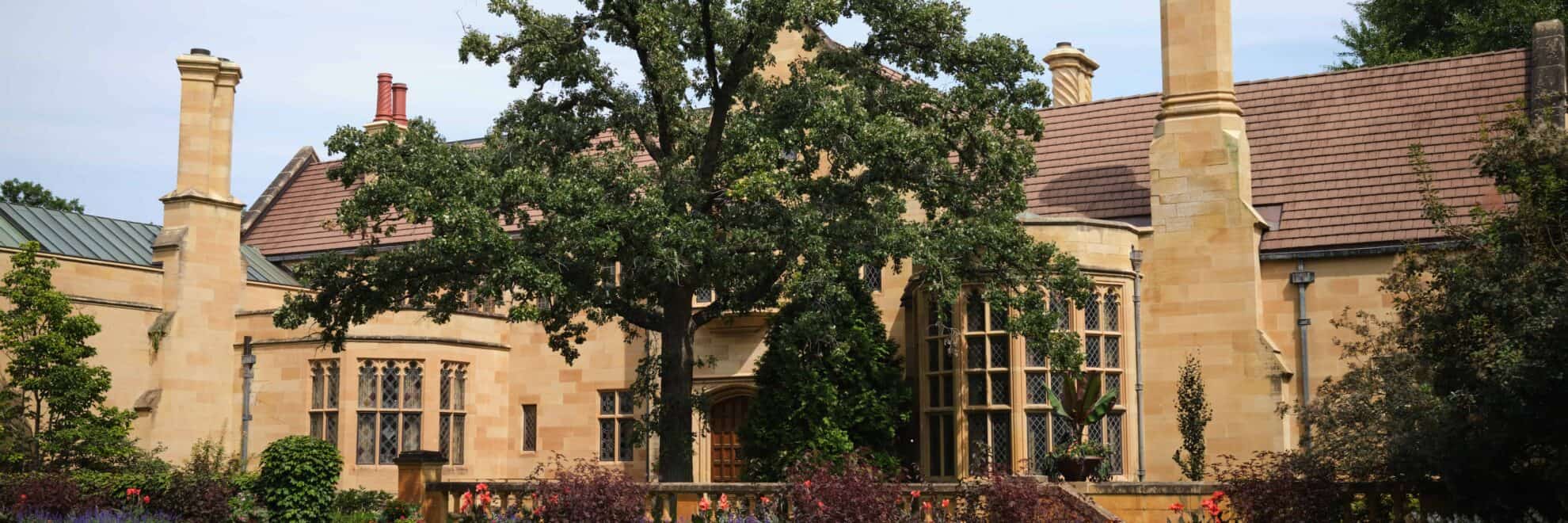 The front façade of the Paine mansion in late summer.