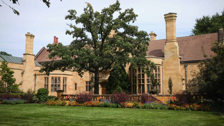 The front façade of the Paine mansion in late summer.