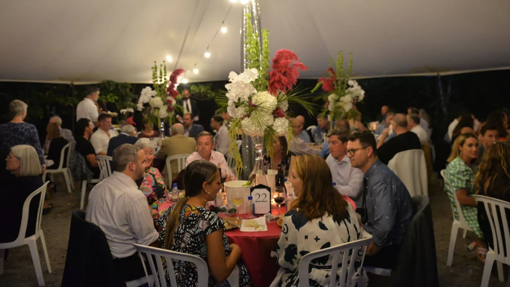 Guests dine and socialize during Jazz in the Gardens.