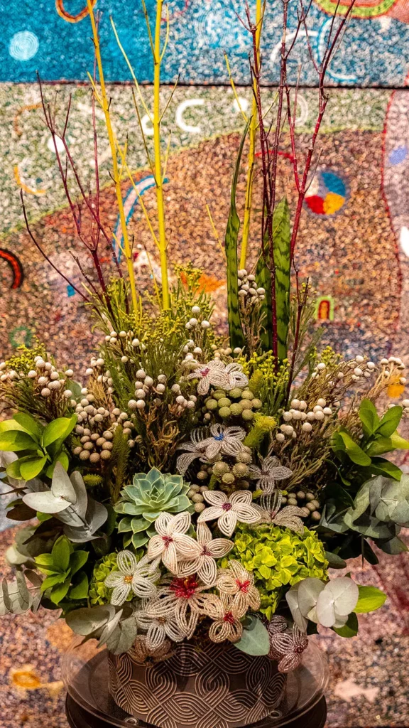 A floral arrangement in the Main Gallery presents shades of green in a variety of florals.