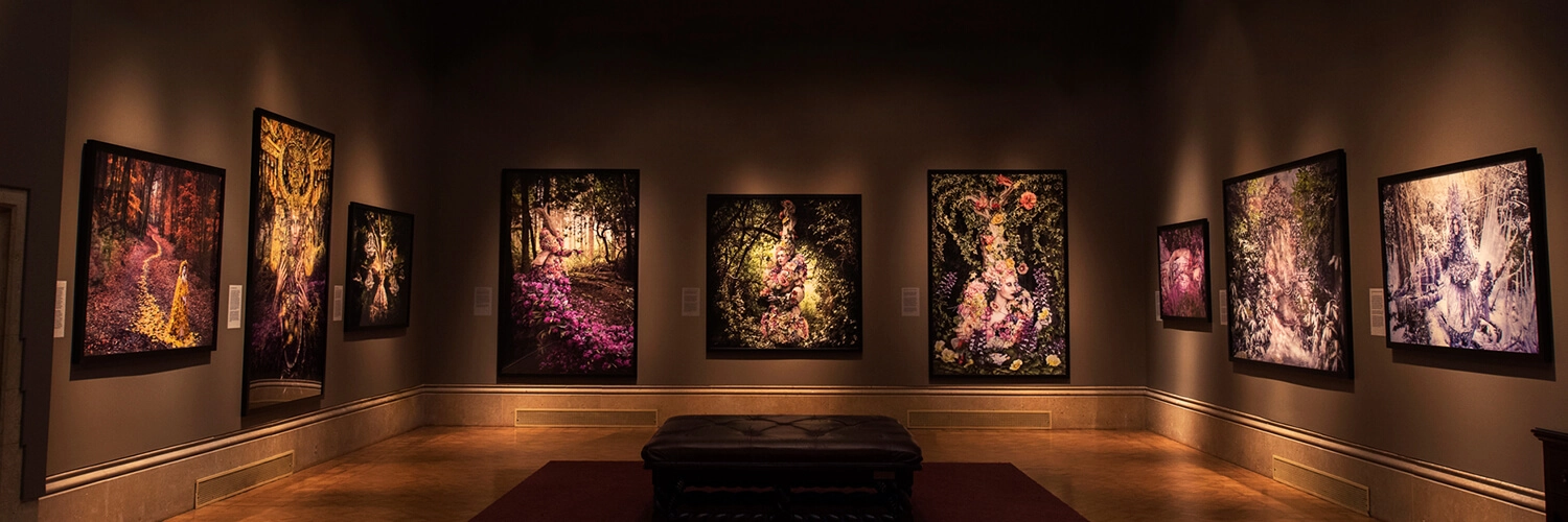 Photographs by Kirsty Mitchell hang in the Main Gallery.