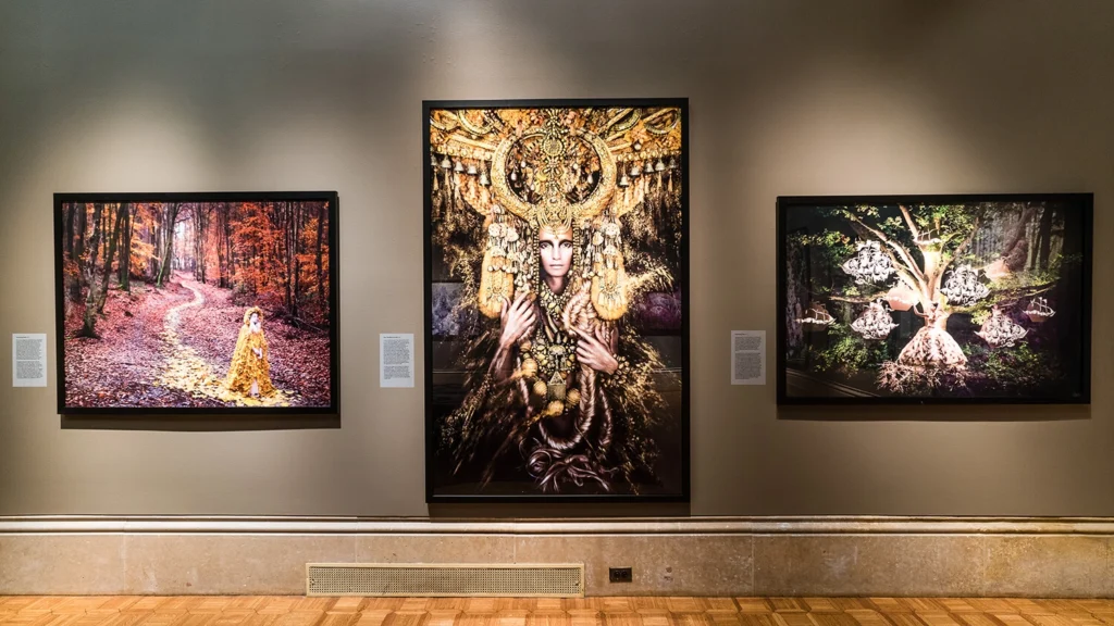 Photographs by Kirsty Mitchell hang in the Main Gallery.