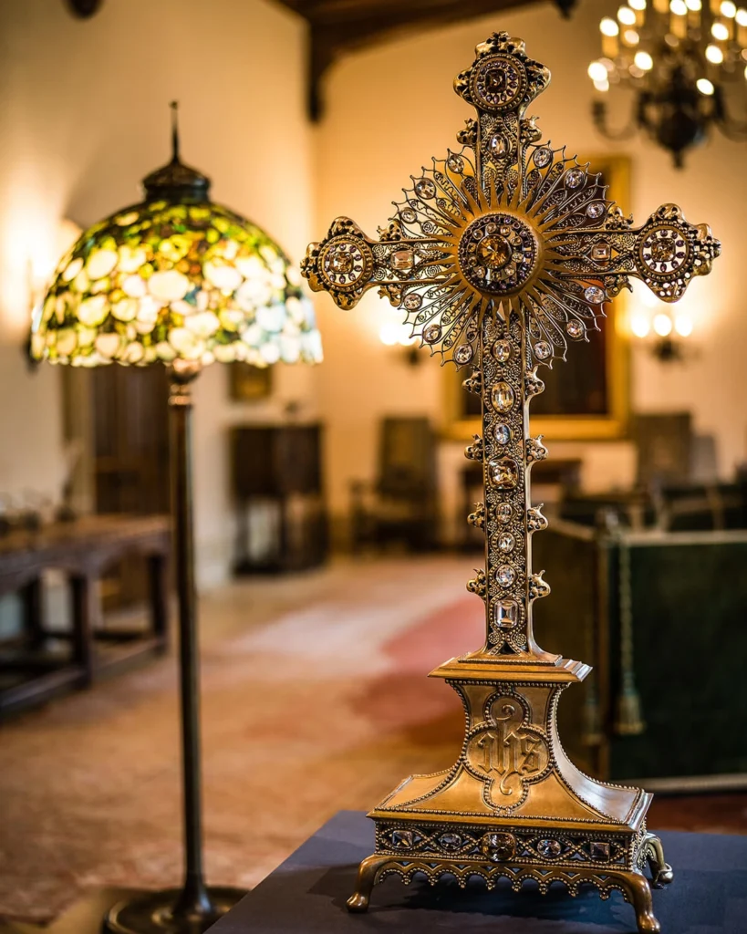 A stained glass lamp and cross on view in the Great Hall.