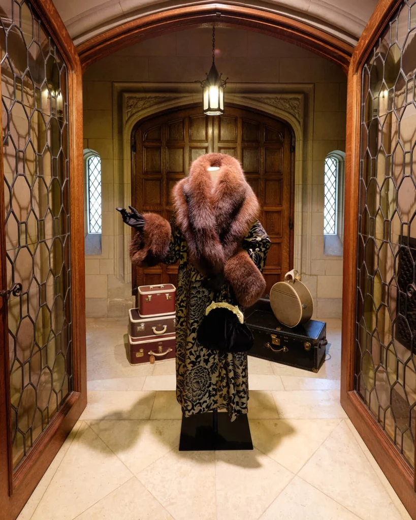 "Downton Abbey” costumes on display in the mansion's original entrance.