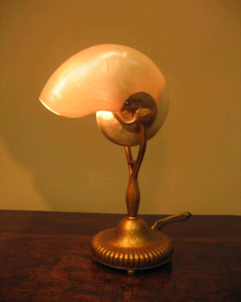 A Tiffany lamp resembling a sea shell.