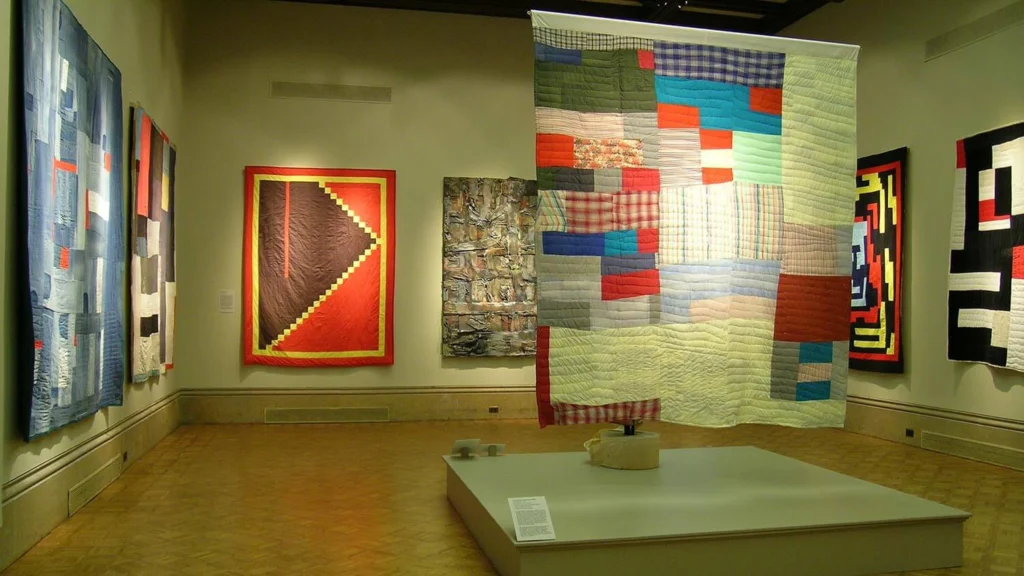 Brightly colored quilts on view in the main gallery.