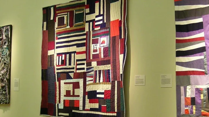 Brightly colored quilts on view in the main gallery.