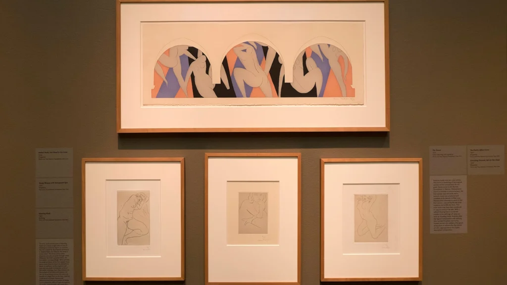 Artworks by Henri Matisse hang on a wall.