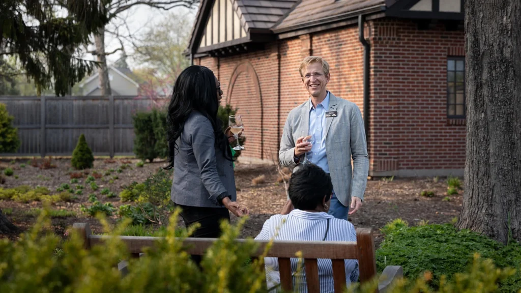 Paine members chat in the gardens in spring.