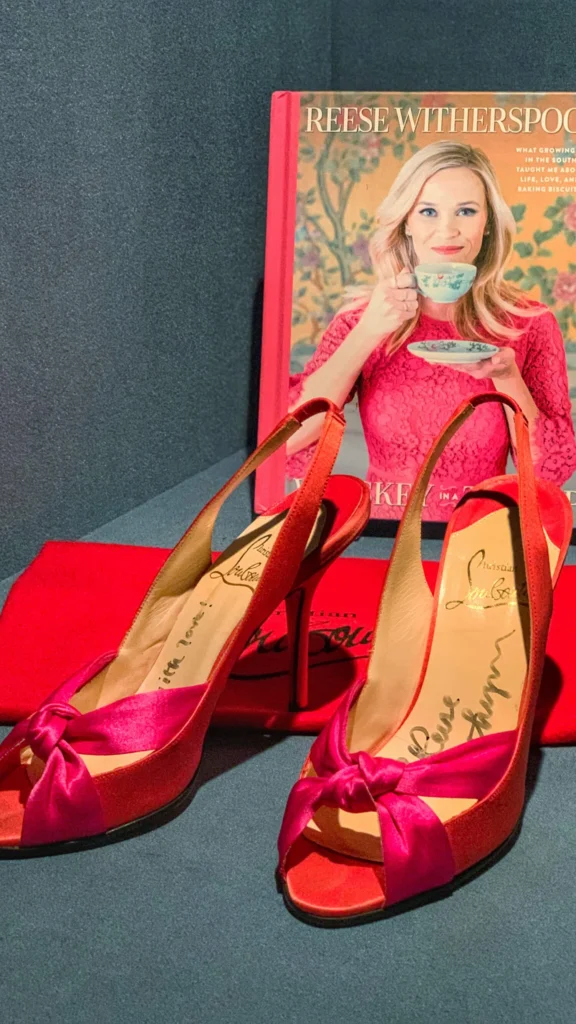 Bright pink slingback heels worn and signed by Reese Witherspoon.