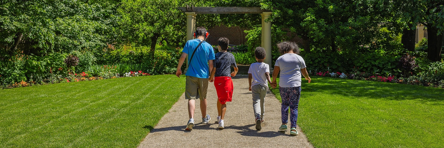 Children walk in the gardens at the Paine