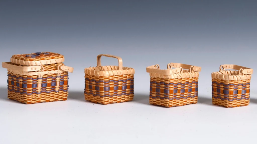 A set of miniature baskets, creation attributed to Joyce Buchanan.