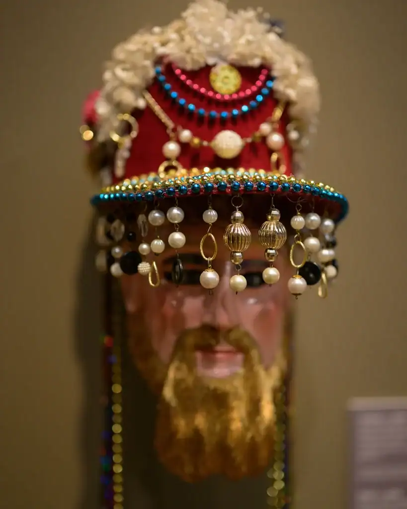 Close up of a Mexican mask on view for "Dancing with Life: Mexican Masks" in the main gallery.