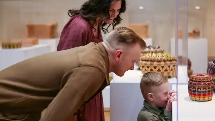 A family views an exhibition