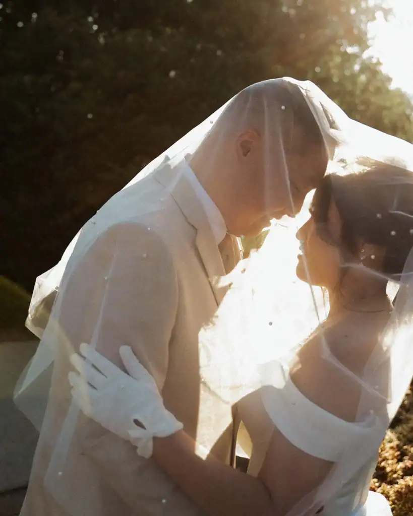 A couple poses on their wedding day.