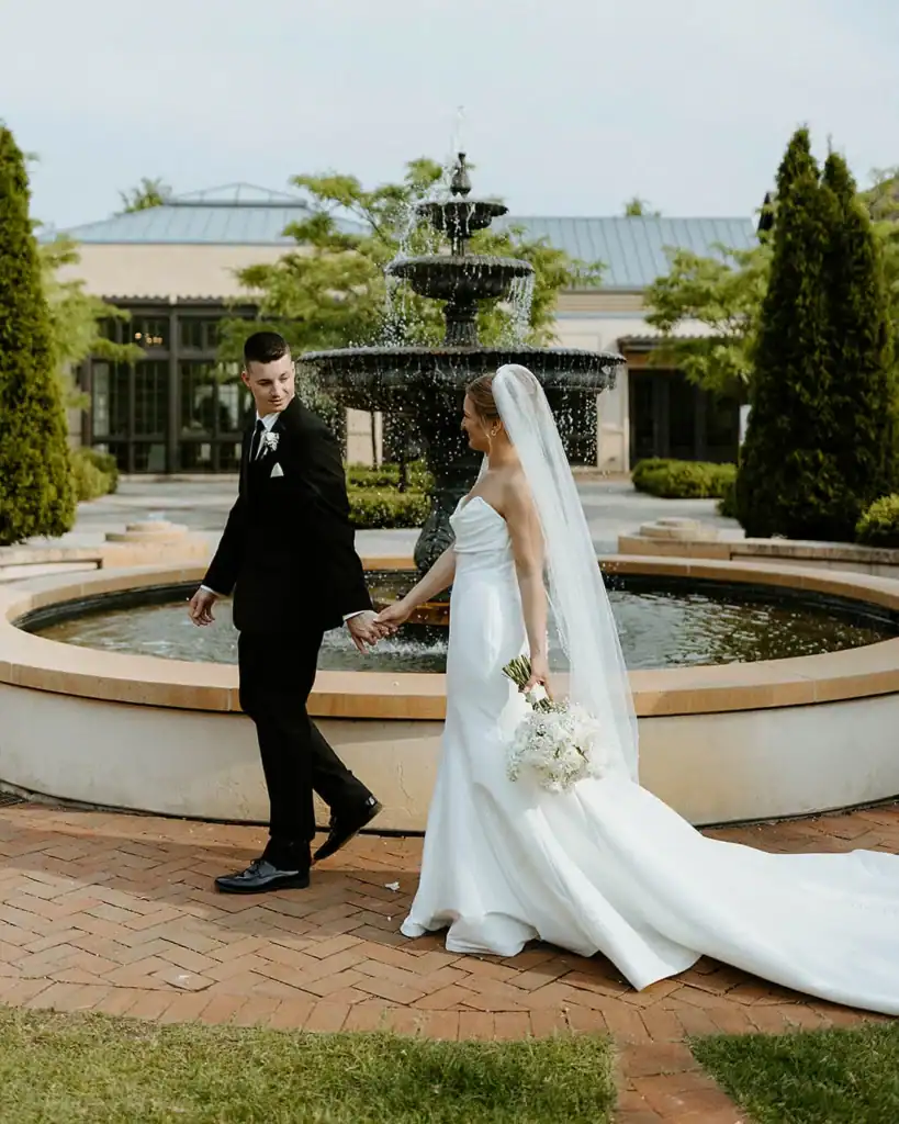 A couple by the water fountain at the Paine