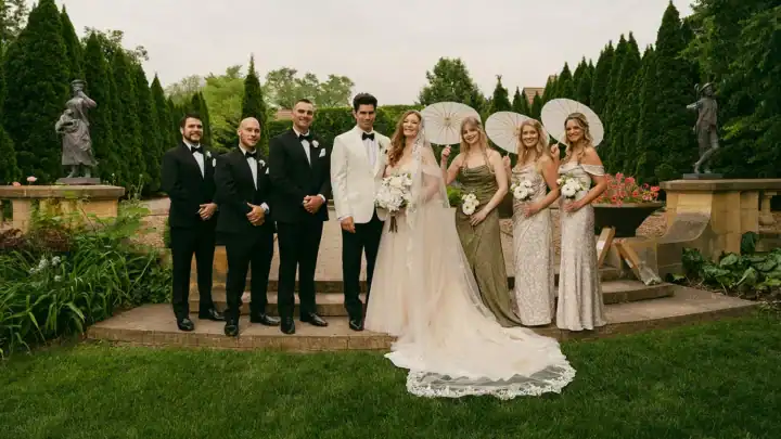 A wedding party poses for a photo